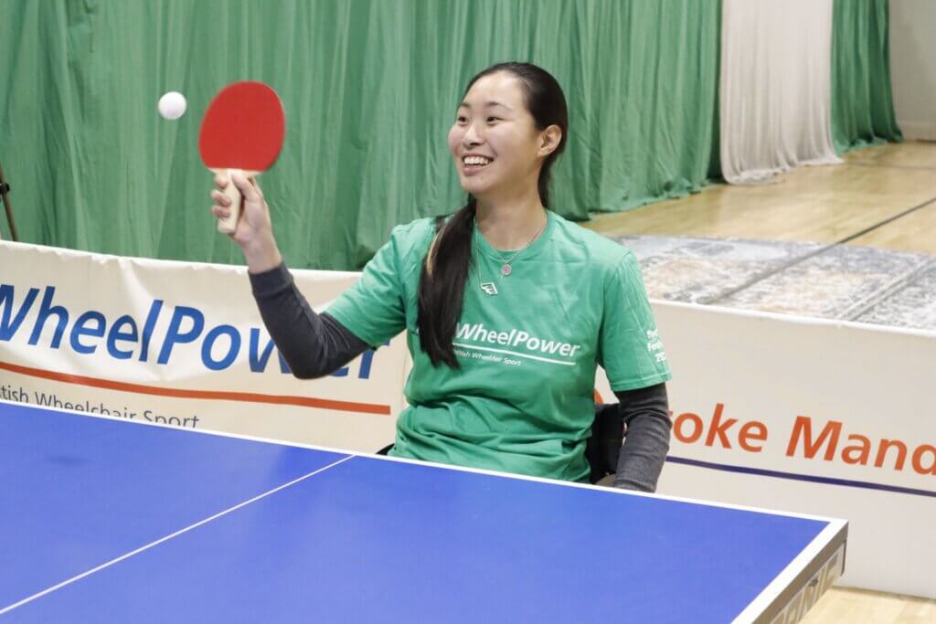 Young athlete playing table tennis at the sports festival
