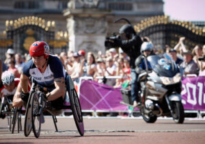 David Weir passes Buckingham Palace in the men's T54 Marathon on the final day of the London 2012 Paralympic Games. 9th September 2012..